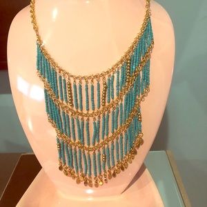 Turquoise and gold chandelier necklace.